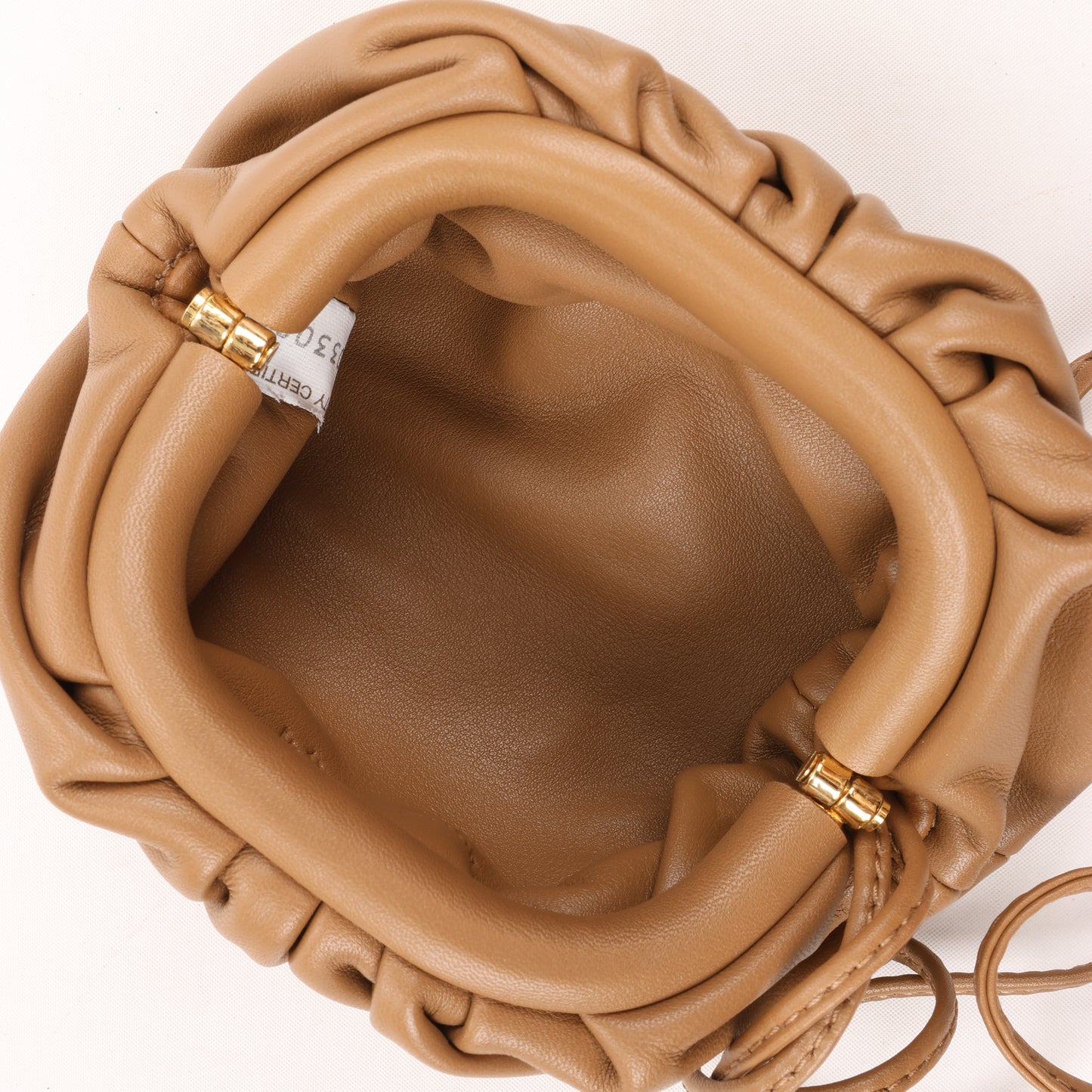 Bottega Veneta Micro The Pouch Leather Crossbody bag in Almond