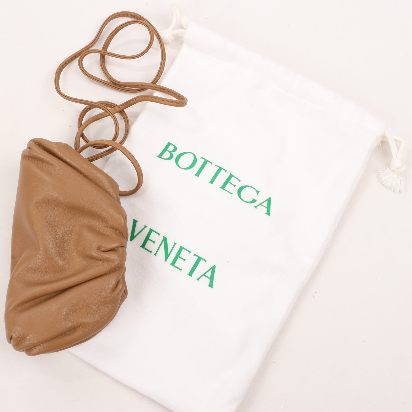 Bottega Veneta Micro The Pouch Leather Crossbody bag in Almond