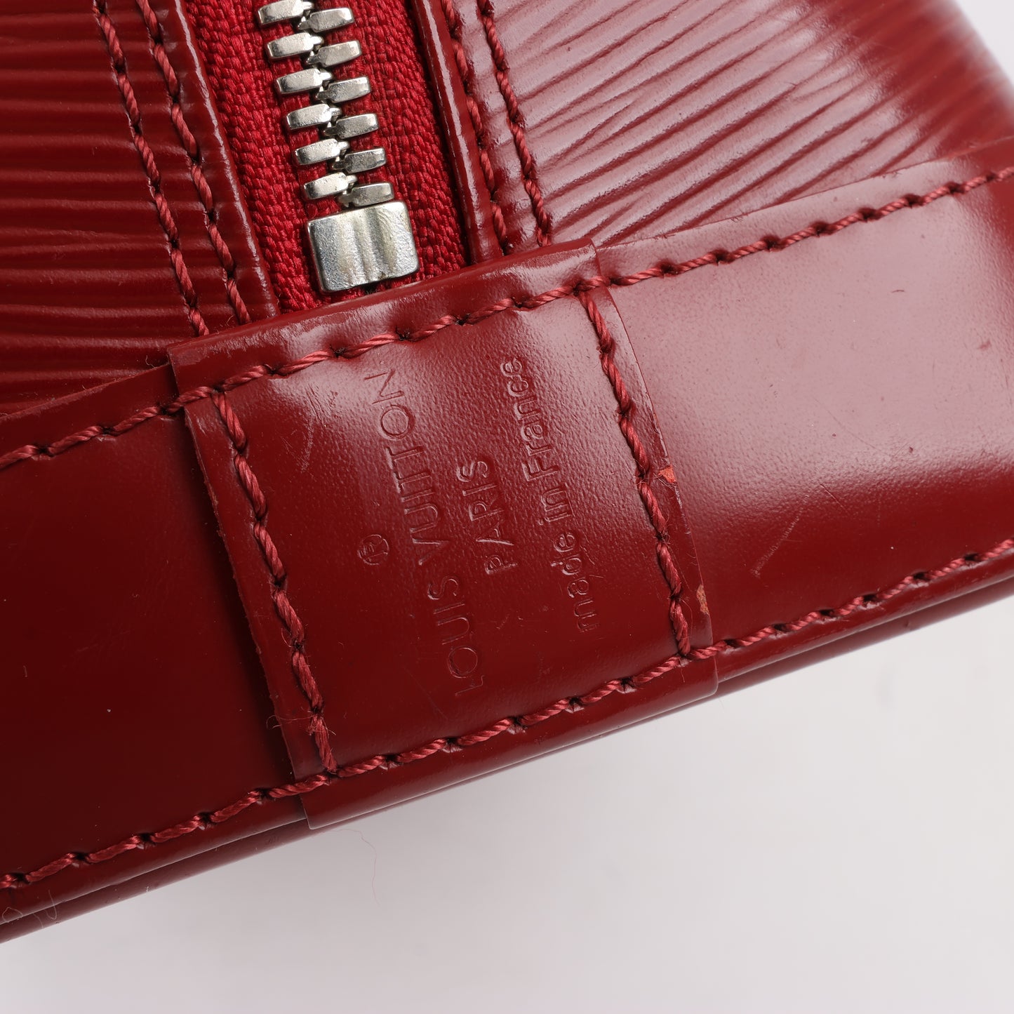 Louis Vuitton Epi Leather Alma Handbag in Deep Red M4030M