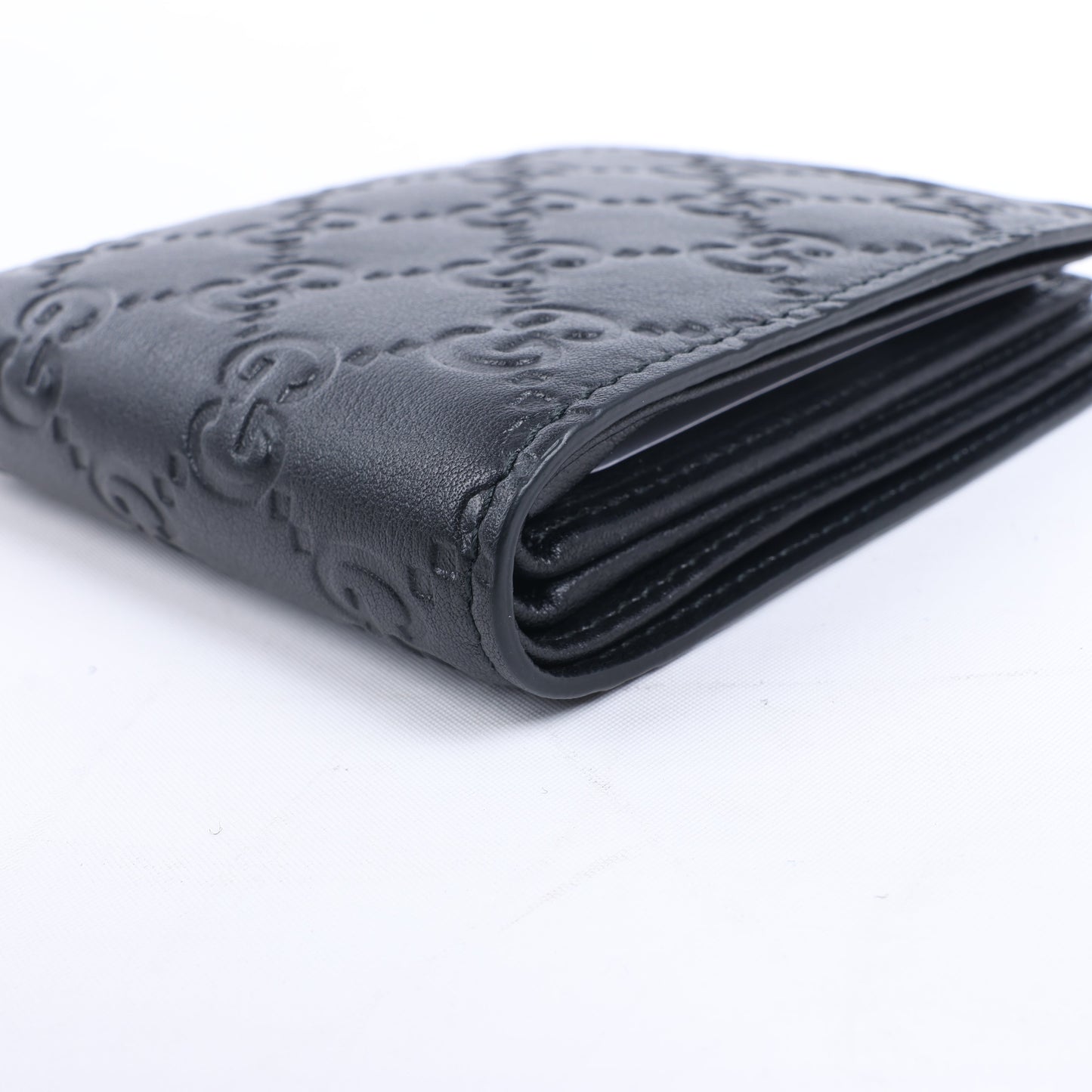 Gucci Guccissima 212185 Kompakte Geldbörse aus Leder in Schwarz