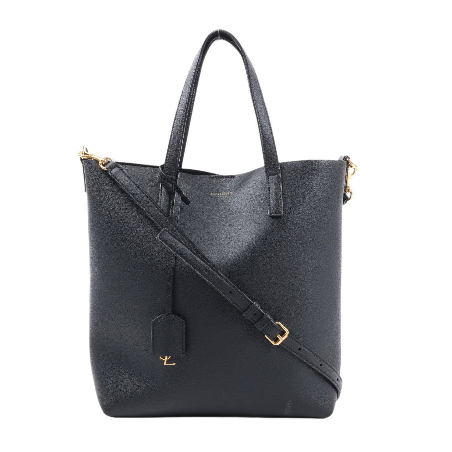 Black leather tote bag with gold accents on a white background