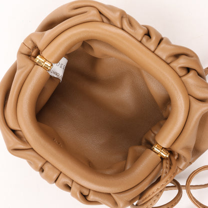 Bottega Veneta Micro The Pouch Leather Crossbody bag in Almond