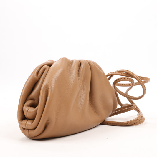 Bottega Veneta Micro The Pouch Leather Crossbody bag in Almond