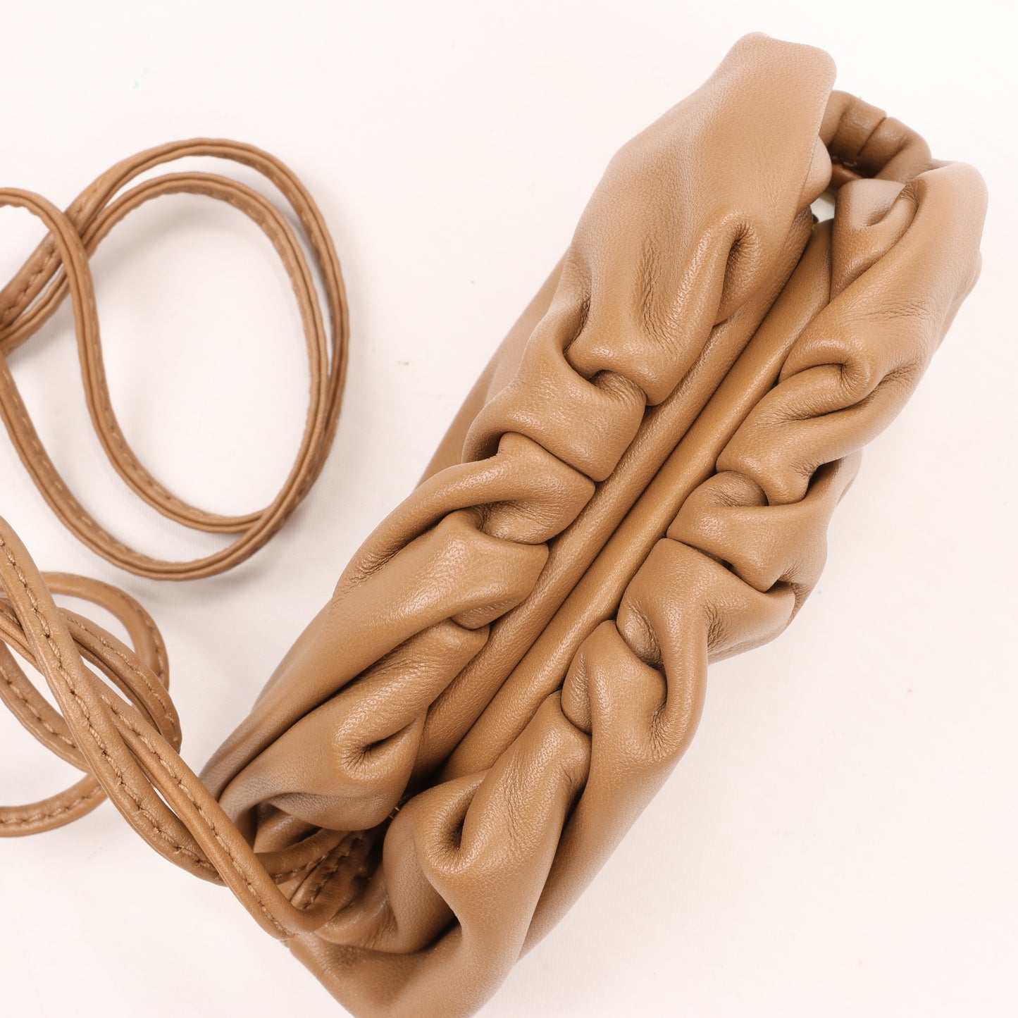 Bottega Veneta Micro The Pouch Leather Crossbody bag in Almond