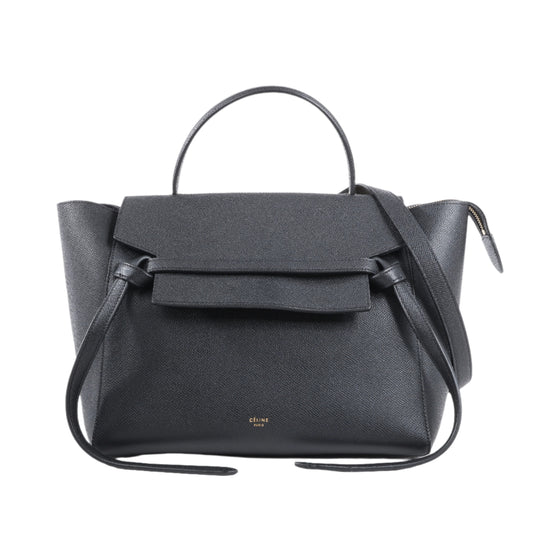 Black handbag with a strap on a white background