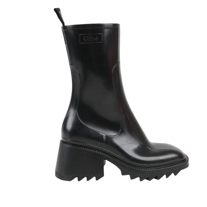 Black rubber boot with a brand logo on a white background