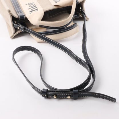 Chloé Woody Kleine 2-Wege-Handtasche aus Canvas und Leder in Beige x Schwarz