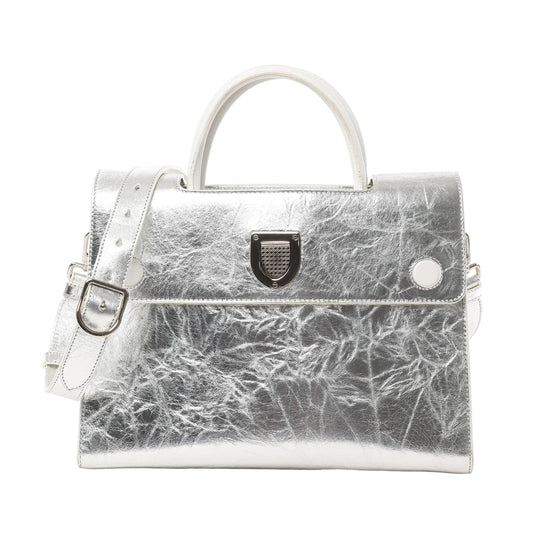 Front view of Christian Dior Diorever Medium Leather 2Way Handbag in metallic silver, featuring a structured design, top handle, detachable shoulder strap, and signature Dior clasp closure against a white background.