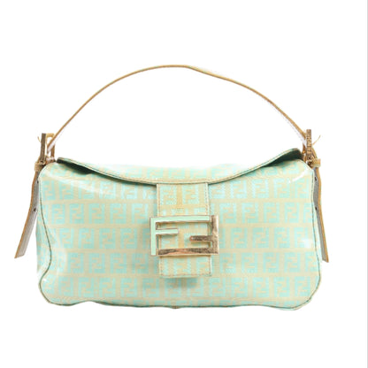 Light blue handbag with gold accents on a white background
