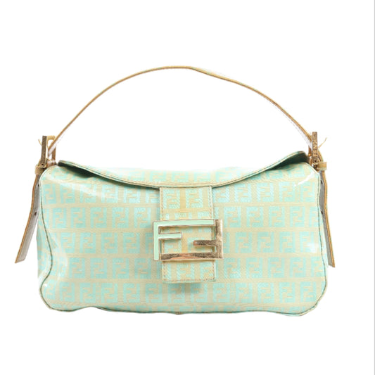 Light blue handbag with gold accents on a white background