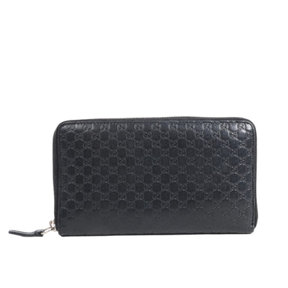 Black Gucci textured wallet on a white background