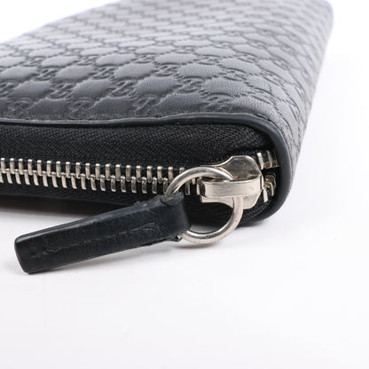 Gucci Microguccissima – Große Organizer-Geldbörse mit Rundum-Reißverschluss in Schwarz