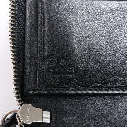 Gucci Microguccissima – Große Organizer-Geldbörse mit Rundum-Reißverschluss in Schwarz