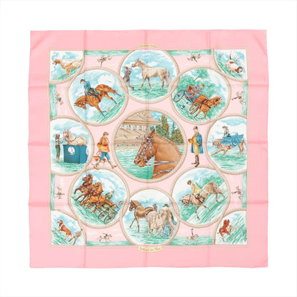 Hermès Carré 90 "Auteuil en Mai" Silk Scarf in pink, featuring equestrian-themed illustrations within circular frames, including horses, riders, and trainers, bordered by a solid pink edge with intricate detailing on soft silk fabric.
