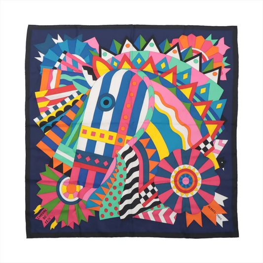 Hermès Carré 90 "Cheval de Fête" silk scarf featuring a colorful abstract horse design with geometric and ribbon patterns in pink, blue, green, orange, and yellow on a navy background, displayed flat.