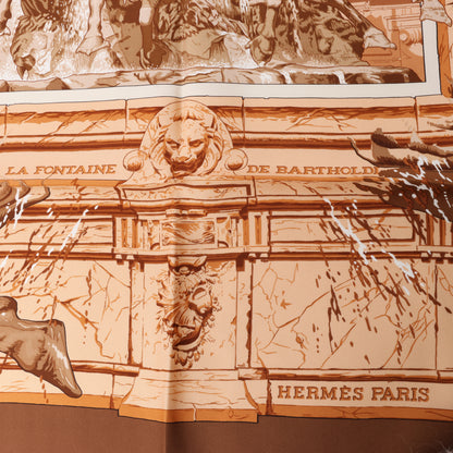 Hermès Carré 90 " LA FONTAINE DE BARTHOLD" 100% Silk Scarf in Brown