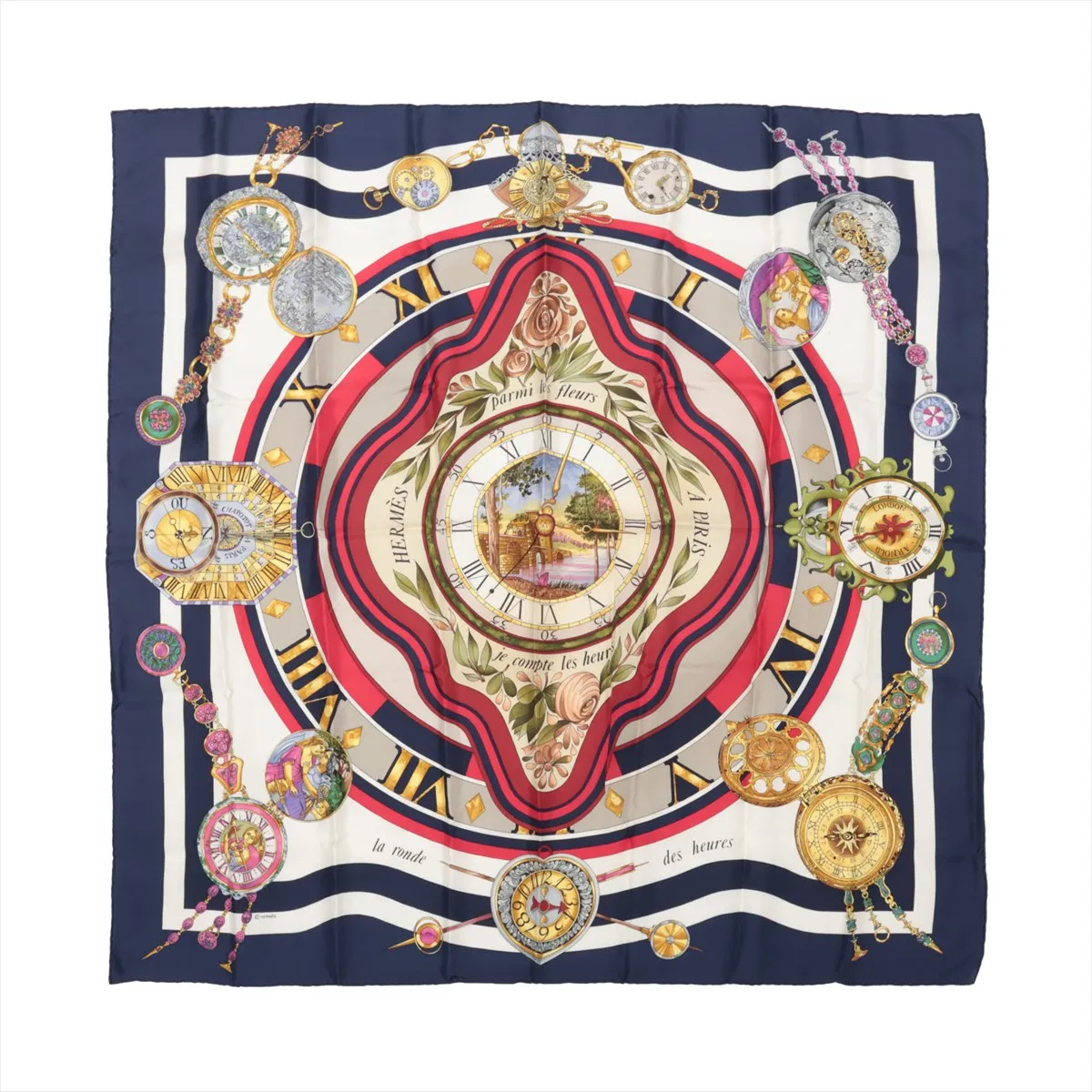 Hermès Carré 90 "Parmi les Fleurs je Compte les Heures" silk handkerchief in navy blue, showcasing a central floral-framed clock surrounded by ornate vintage-style timepieces and Roman numerals, with red, cream, and gold accents on luxurious silk fabric.