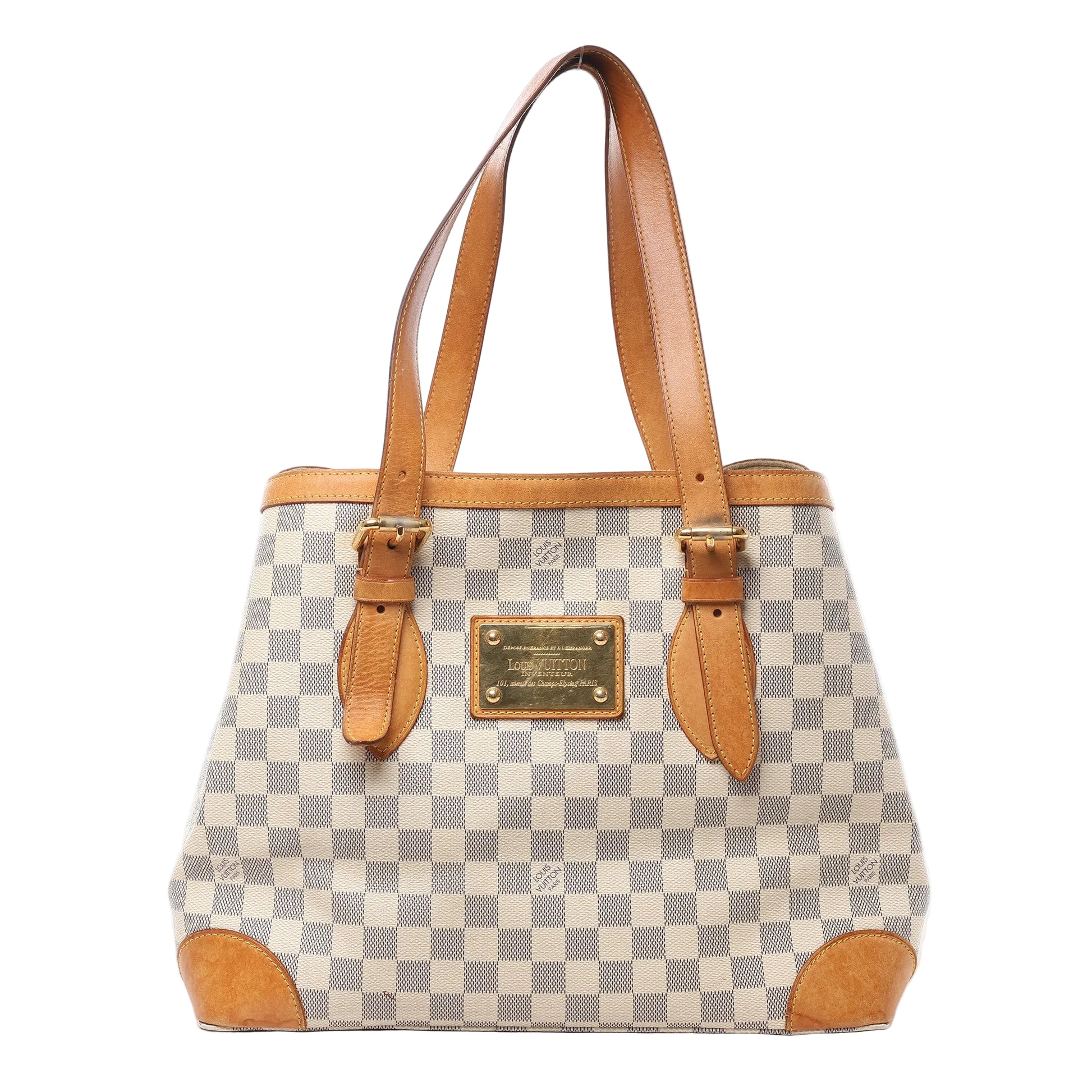 Front view of Louis Vuitton Damier Azur Hampstead MM handbag N51206 in cream and blue checkered coated canvas, featuring natural leather trim and handles, gold-tone nameplate, and structured silhouette against a white background.