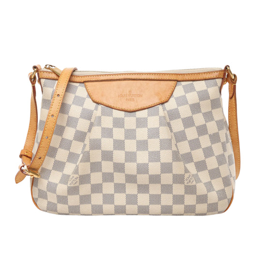 Front view of Louis Vuitton Damier Azur Siracusa PM Shoulder Bag N41113 with cream and blue checkered canvas, natural leather trim and strap, and zip closure, displayed against a white background.