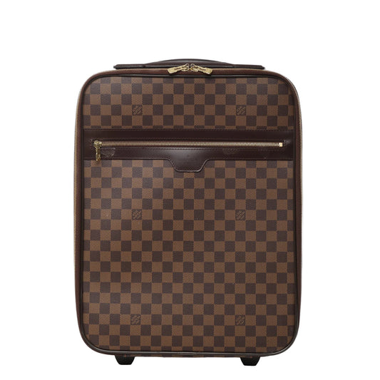 Front view of Louis Vuitton Damier Pégase 45 suitcase N23293 in brown checkered coated canvas, featuring dark brown leather trim, front zip pocket, gold-tone hardware, and two rolling wheels against a white background