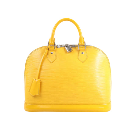 Yellow handbag with a visible brand logo on a white background