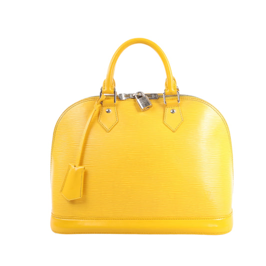 Yellow handbag with a visible brand logo on a white background