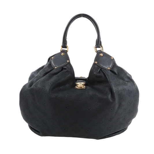 Black handbag with gold accents on a white background