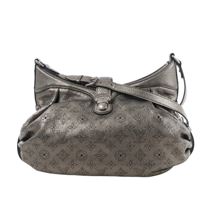 Silver handbag with a pattern on a white background