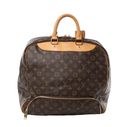 Front view of Louis Vuitton Monogram Canvas Evasion Weekend Handbag M41443 in brown monogram coated canvas, featuring natural leather top handles, gold-tone hardware, and front zip pocket against a white background.