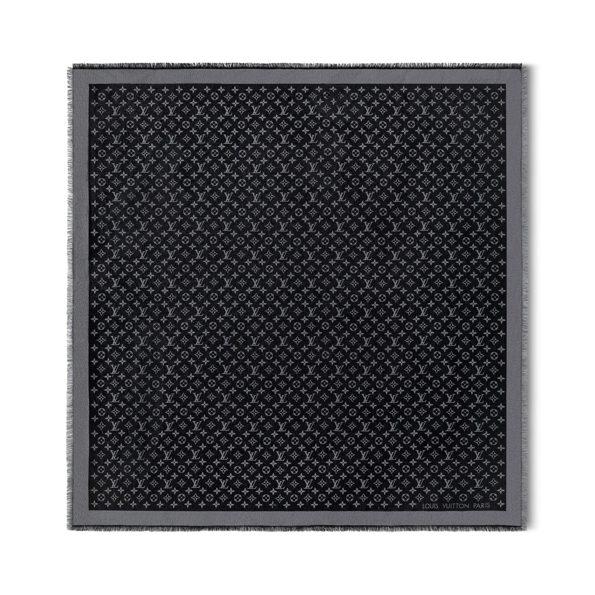 Black patterned fabric square on a white background