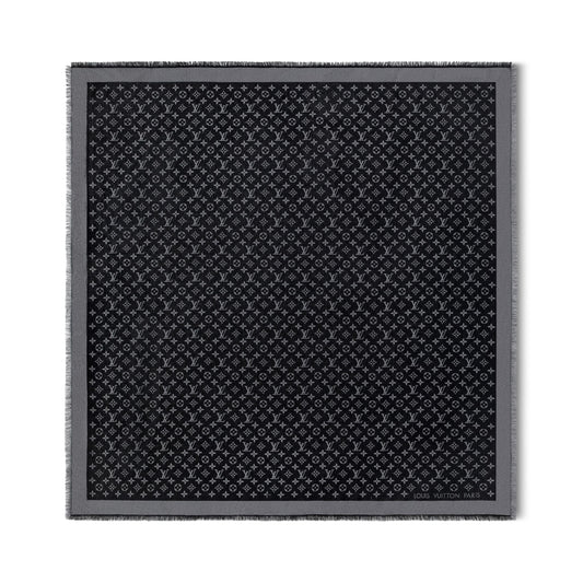Black patterned fabric square on a white background