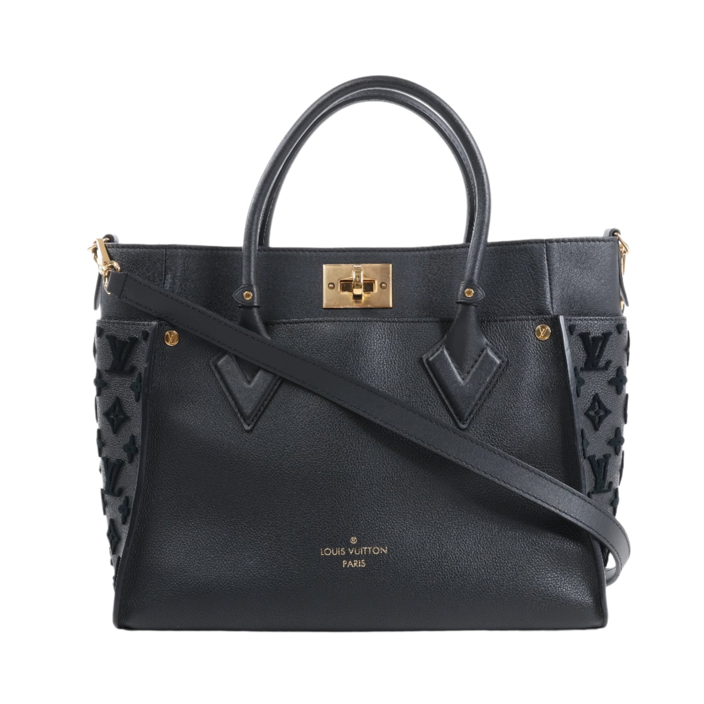 Black handbag with gold accents on a white background