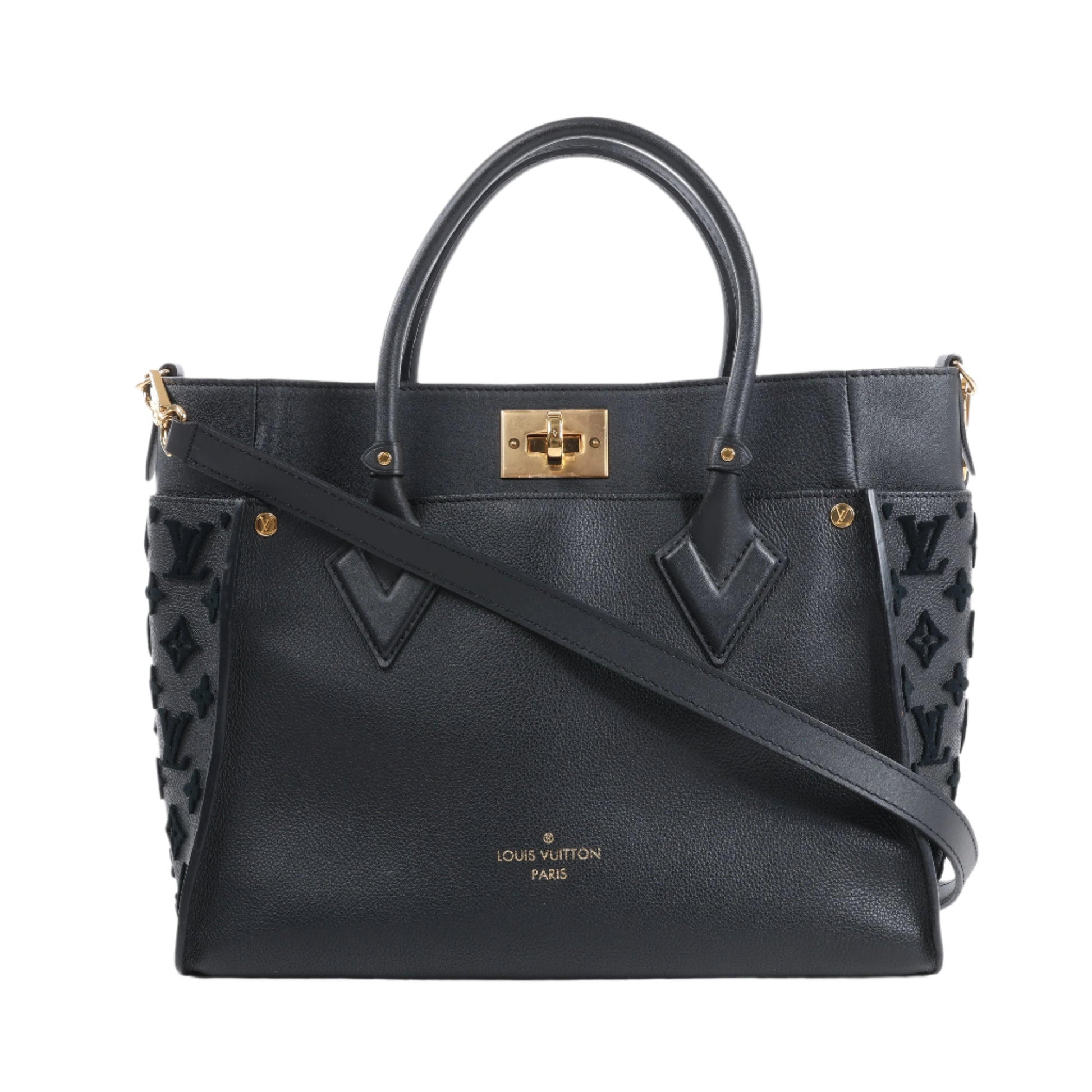 Black handbag with gold accents on a white background