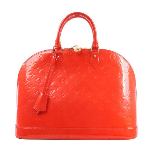 Red handbag with a brand logo on a white background