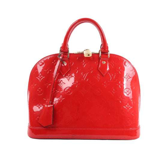 Red handbag with a brand logo on a white background