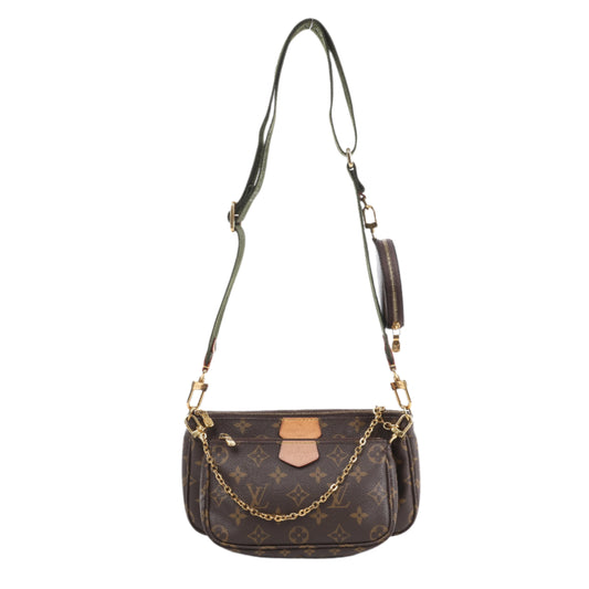 Brown monogram handbag with gold chain and strap on a white background
