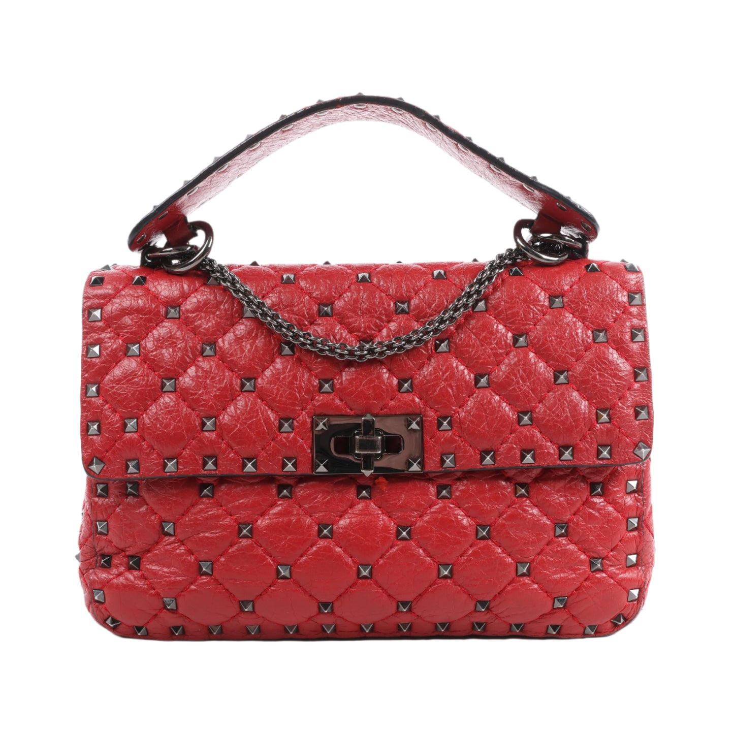 Red quilted handbag with studded details on a white background