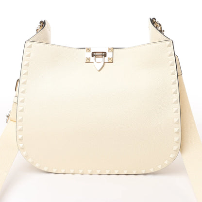 Valentino Garavani Sac à bandoulière en cuir Rockstud en écru