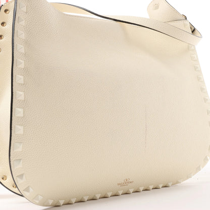 Valentino Garavani Sac à bandoulière en cuir Rockstud en écru